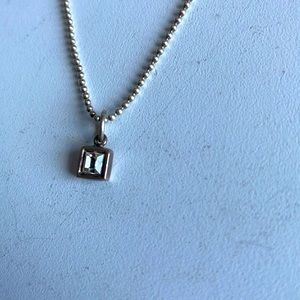15” necklace with small fake diamond in a square frame.